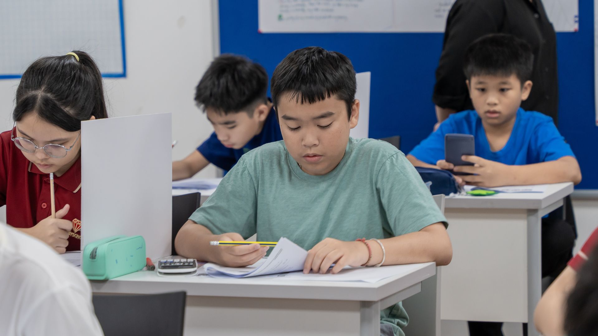 Students taking the exam at AMC 2024.